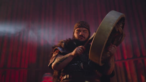 Man-in-Altai-clothes-plays-shamanic-drum-at-fertility-ritual