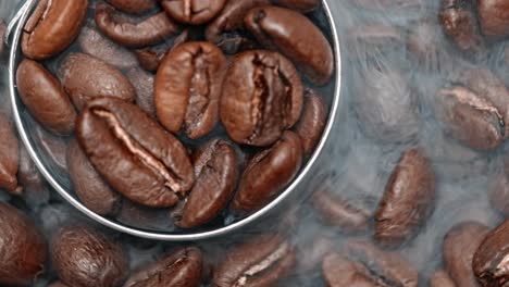 close up of seeds of coffee. fragrant coffee beans are roasted smoke comes from coffee beans.