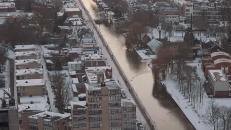 snow falling over utrecht city, netherlands, white covered roofs, high angle view