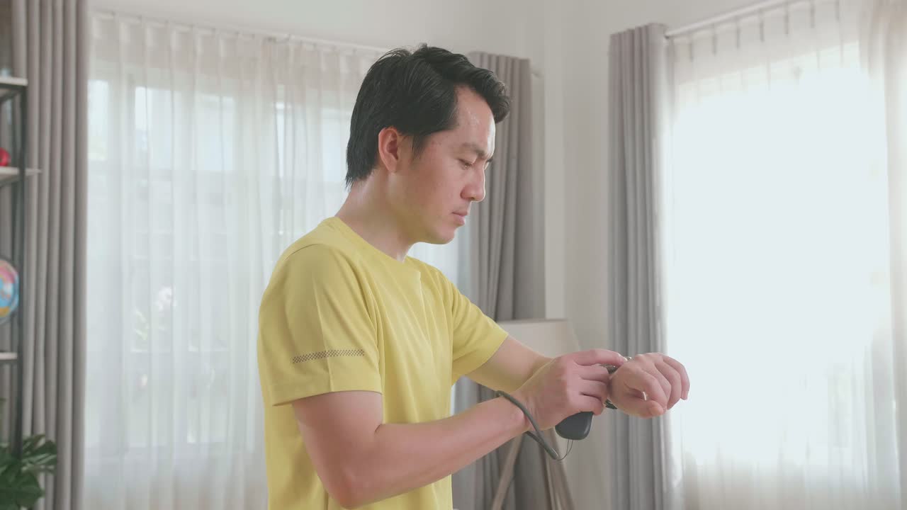 Man checking time in the living room