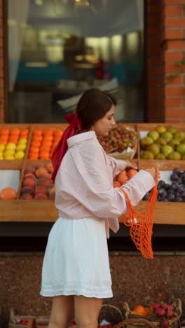 woman shopping for produce at a grocery store