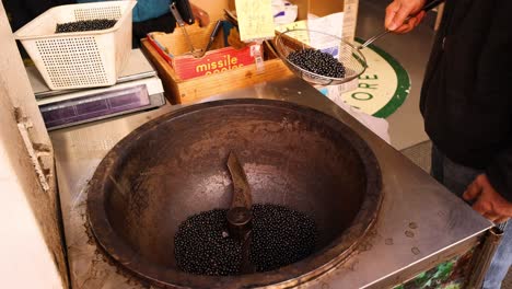 black beans roasted in hot sand by hand