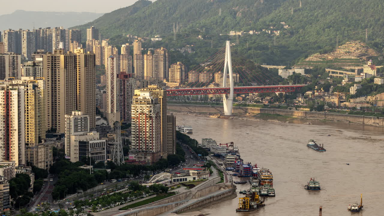 CHONGQING, CHINA - 28 MAY 2025 : Timelapse of the amazing Chongqing cyberpunk city skyline from a high vantage point with the yangtze river