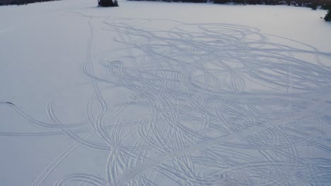 Tracks-in-the-snow-on-a-frozen-lake-in-Ontario-Canada