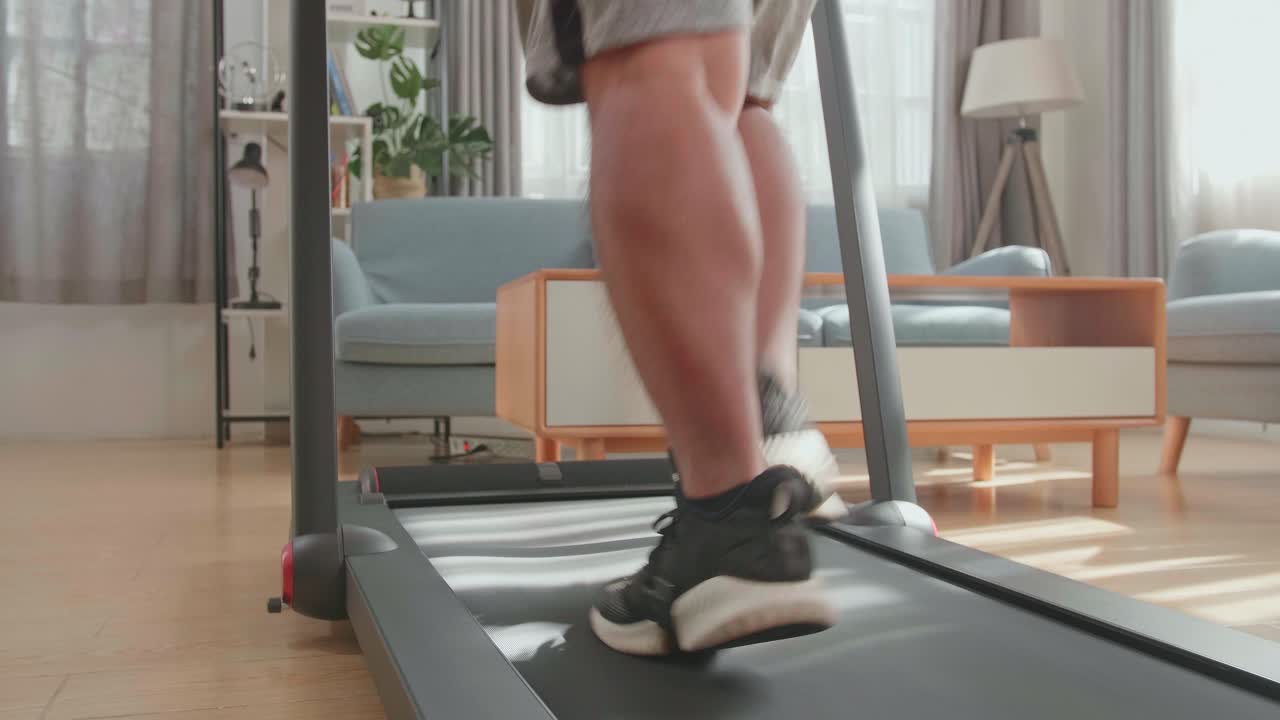 Man Running on Treadmill at Home