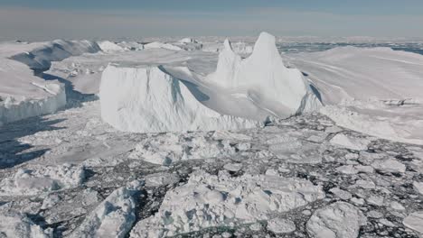 drone over sea and ice of ilulissat icefjord