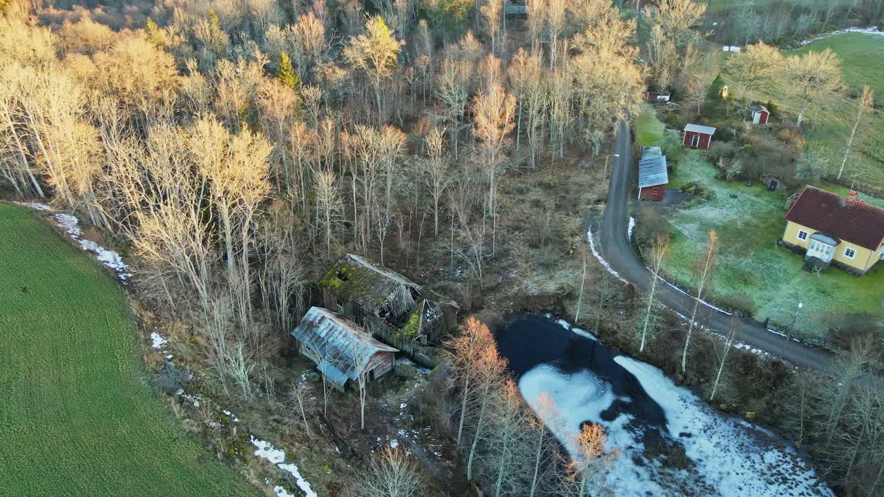 Beautiful aerial of abandoned and collapsed sawmill in rural Sweden