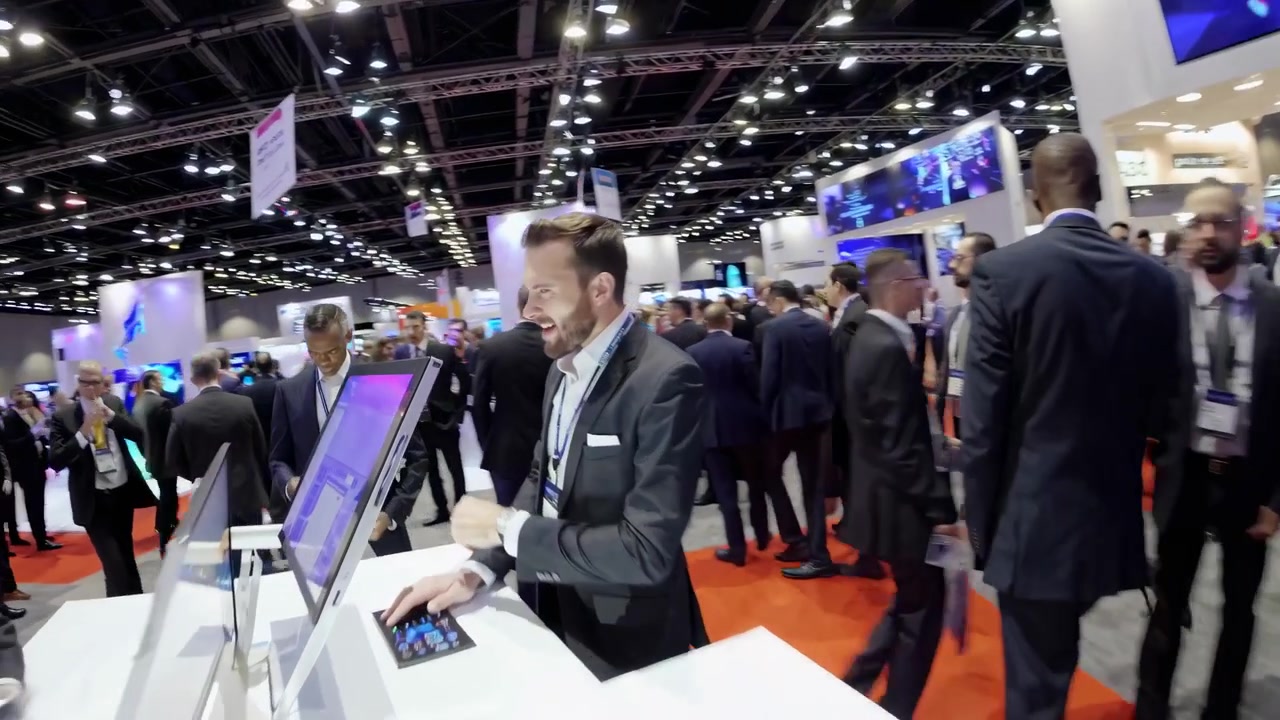 Business Professionals Networking at a Busy Technology Trade Show