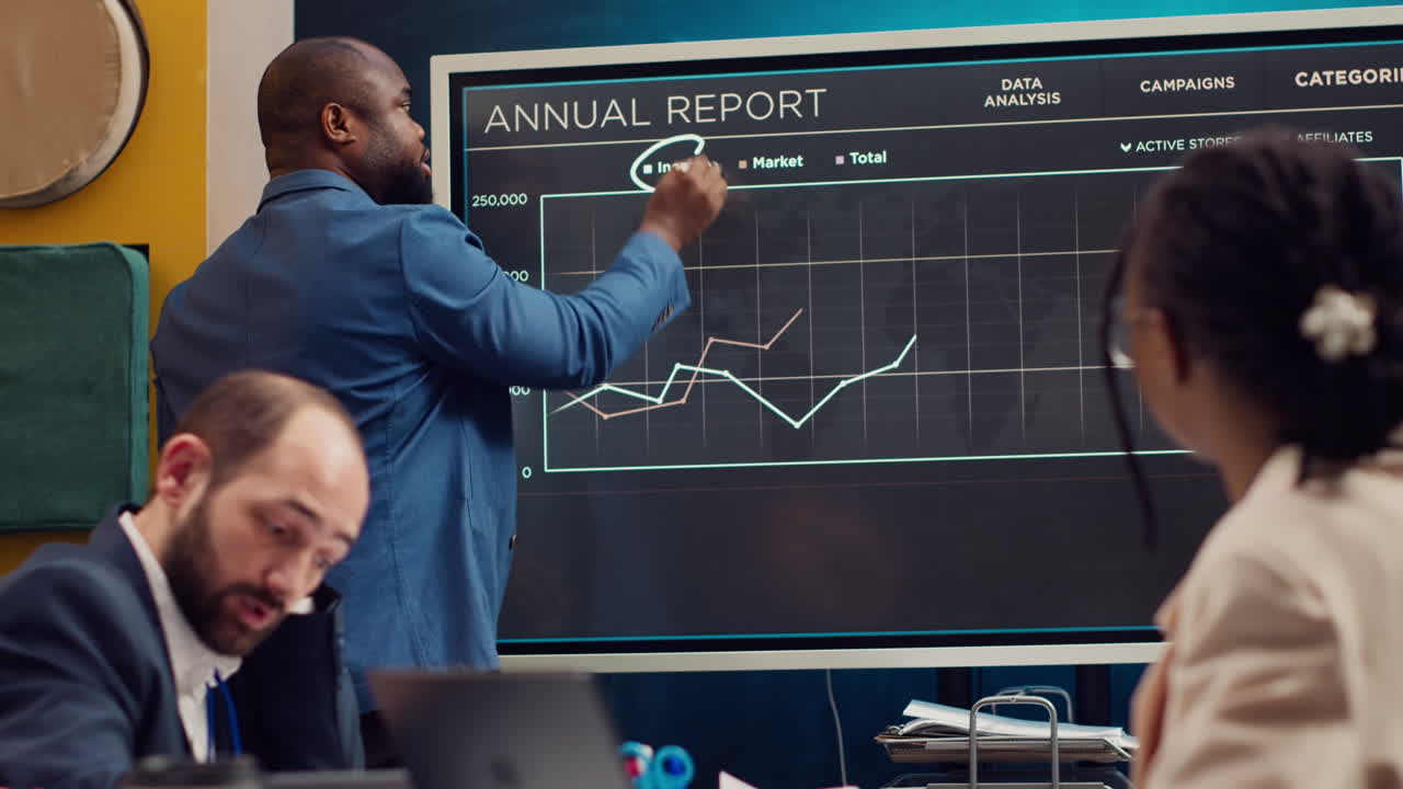 Chief operating officer presenting annual data reports in a conference room
