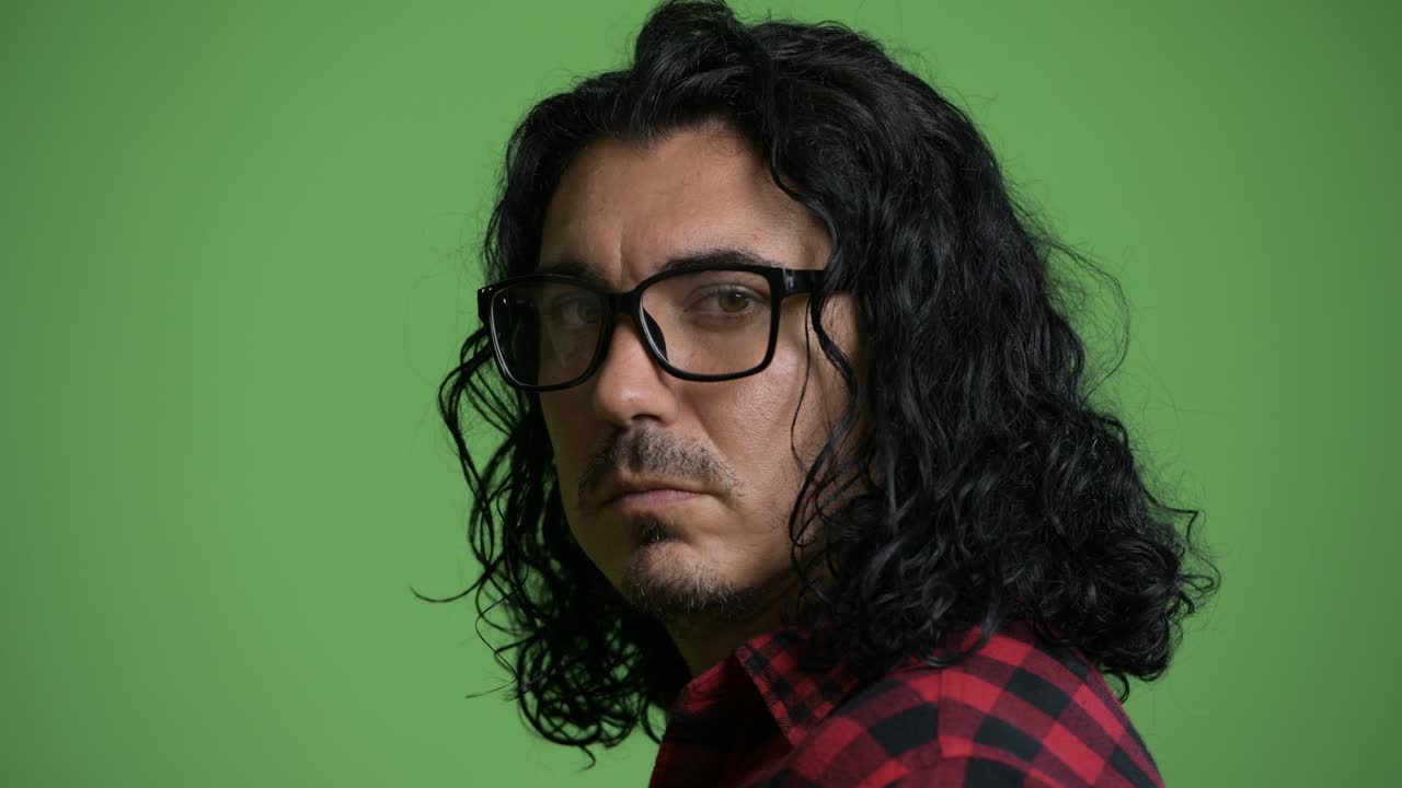 Handsome hipster man looking back