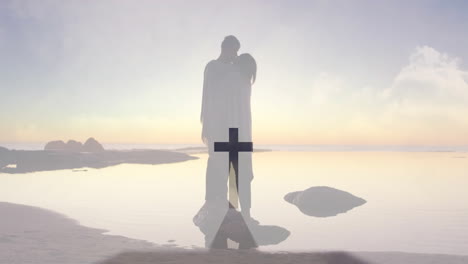 embracing couple on serene beach with cross animation overlay in background