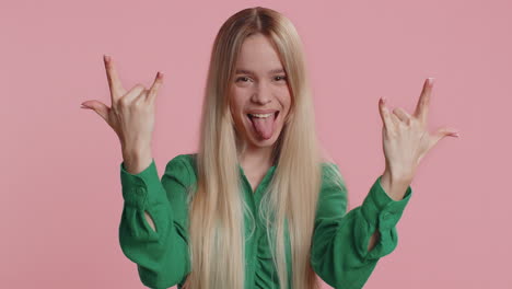 caucasian woman showing rock n roll gesture by hands cool sign crazy expression dancing celebrating