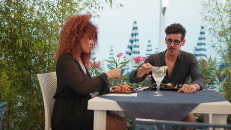 man and woman having an intimate lovely lunch at the beach resort