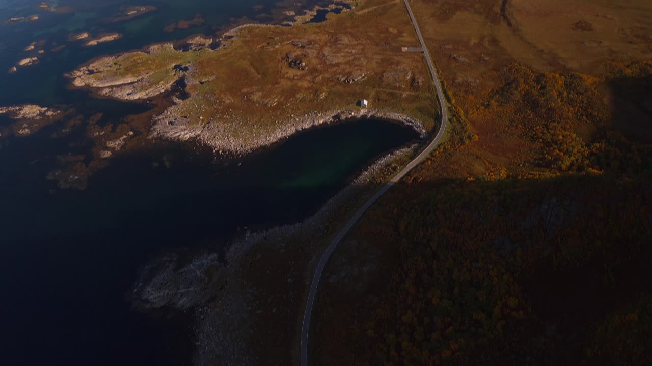 Winding road along rugged coast, capturing Vestarelen's breathtaking landscape