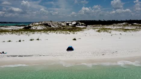beach tent on the white sandy beach of gulf of mexico in shell island, florida
