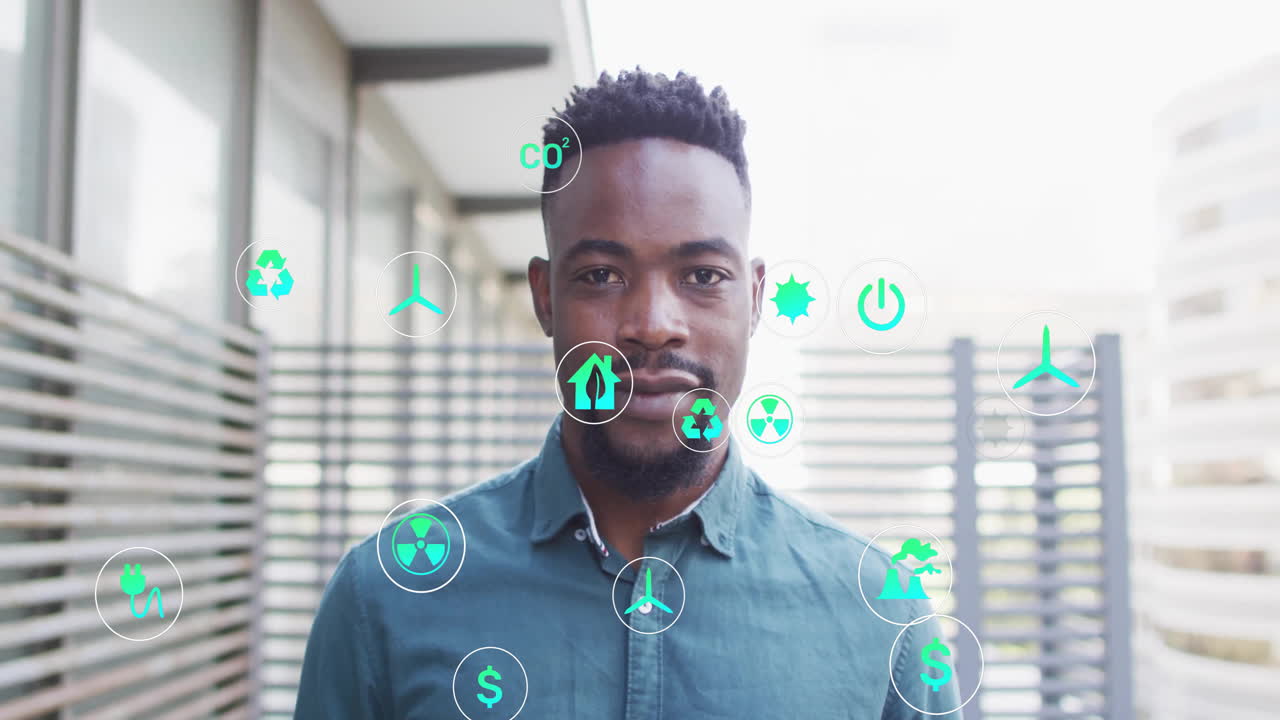 animación de iconos de la ecología sobre empresario biracial sonriendo en la oficina