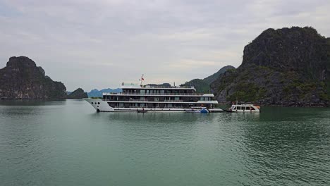 luxury cruise ship across the paradise nature sights in ha long bay, vietnam. wide shot