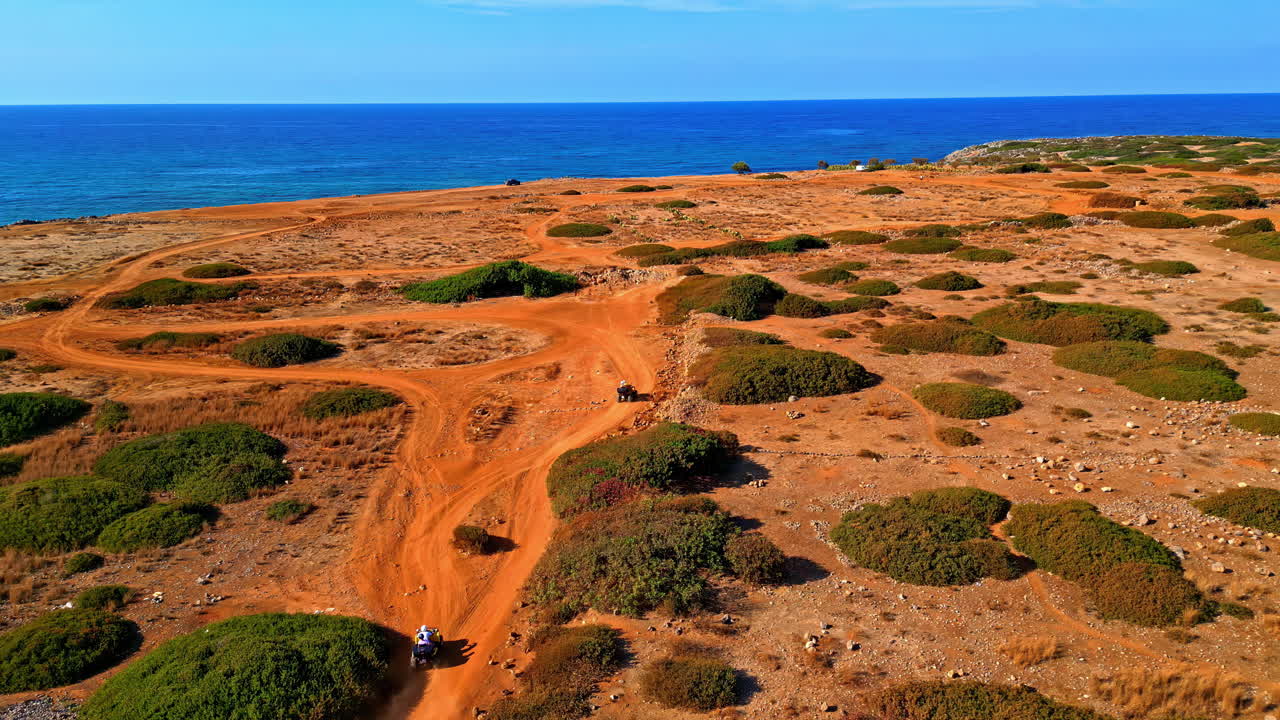 Off-road paths near Potamos Beach, Crete, with coastal scrubland and a vast sea horizon. Crete, Greece