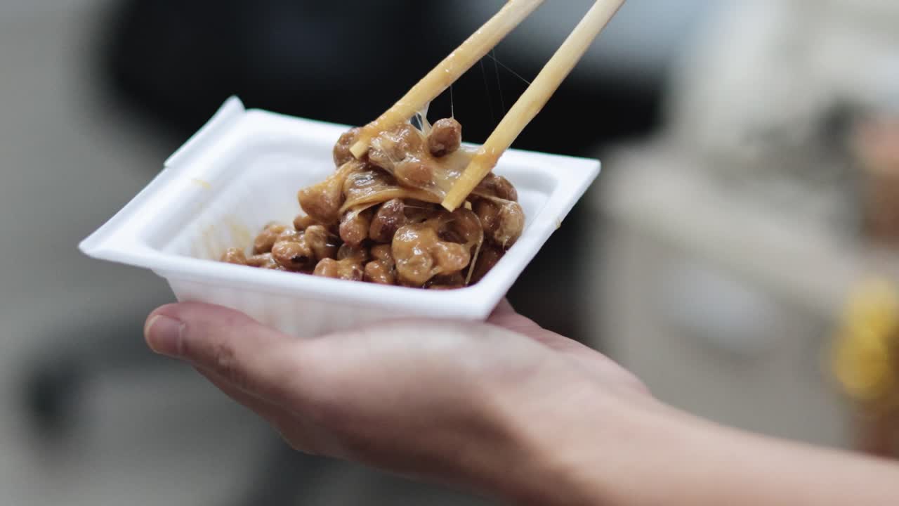 Sequence of eating natto with chopsticks from a bowl