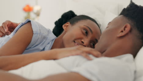 Happy-black-couple-embrace-and-bonding-in-bed