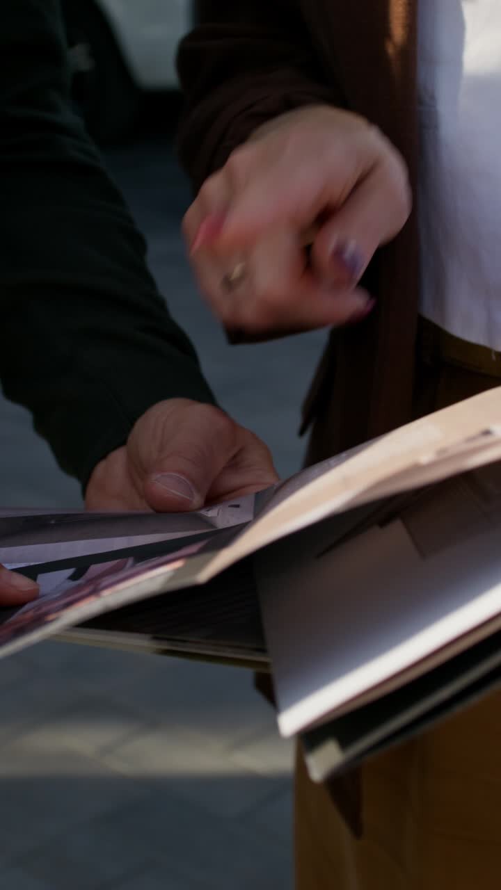People reviewing a magazine