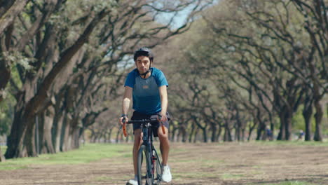 Man Cycling in the Park on a Weekend Day