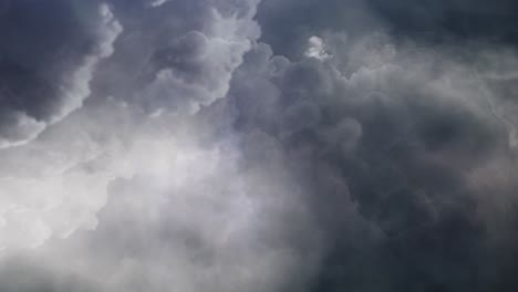 view of flying through dark clouds with lightning strike, thunderstorm