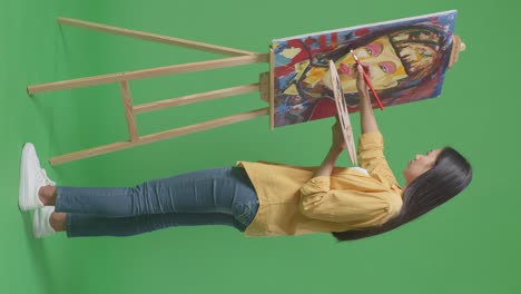 woman painting a portrait