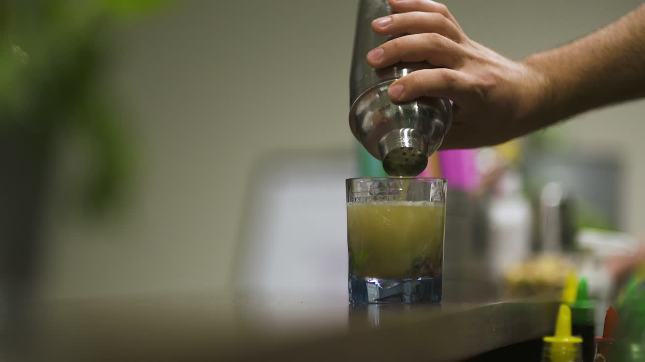 Barman Makes A Drink And Pours Alcohol