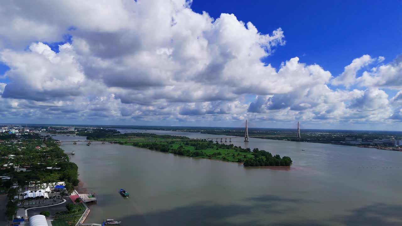 Aerial View Tilt of the River and the Small Park in Can Tho.