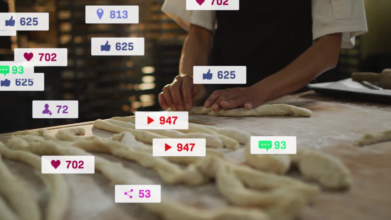 Female baker shaping twisted dough on wooden counter in bakery, with floating social icons