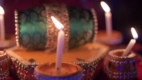 a captivating shot showcases an elegantly decorated candle tray for a traditional asian wedding