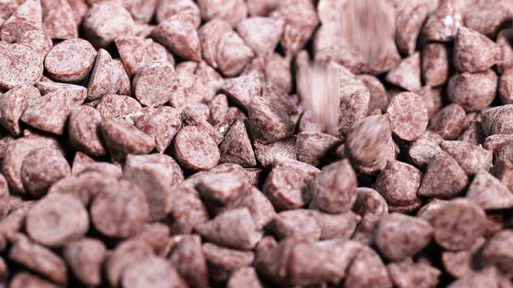 Spoon interacting with chocolate chips in motion