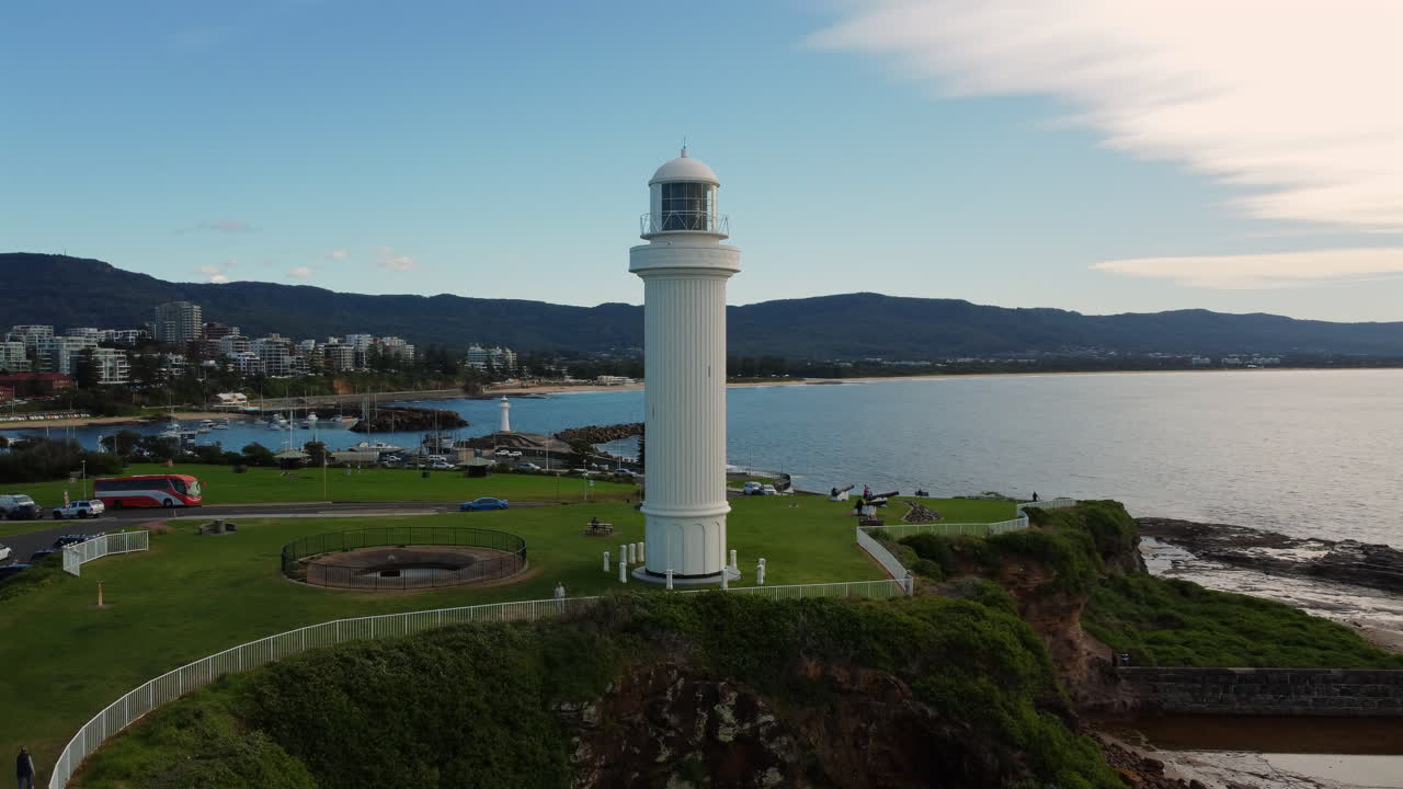 Aerial tracking shot of Flagpoint Staff Lighthouse Wollongong