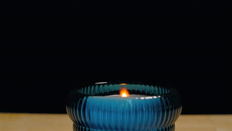 lighting a candle with a disposable cigarette lighter - isolated close up