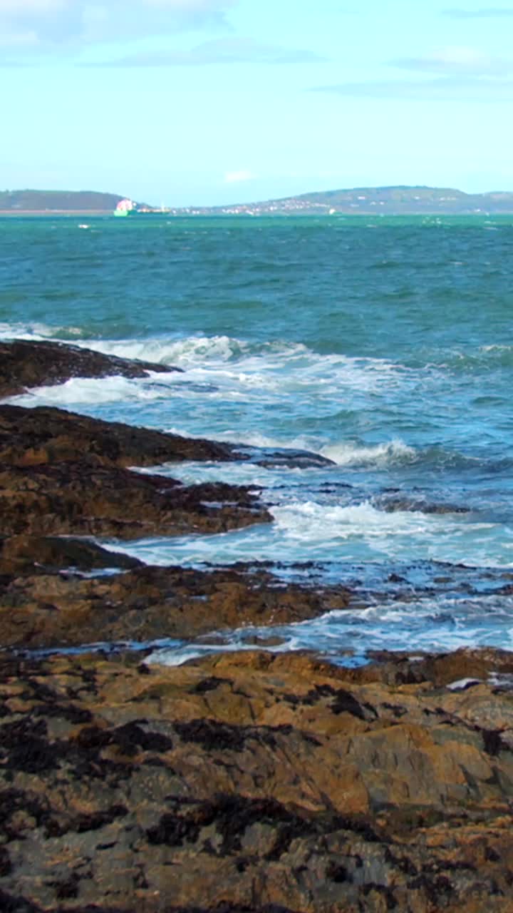 Mid-shot social ratio video of violent waves crashing into rocks. Filmed in 1080x1920 and with Rec709 color