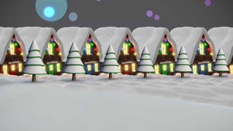 animation of snow falling over houses with fairy lights