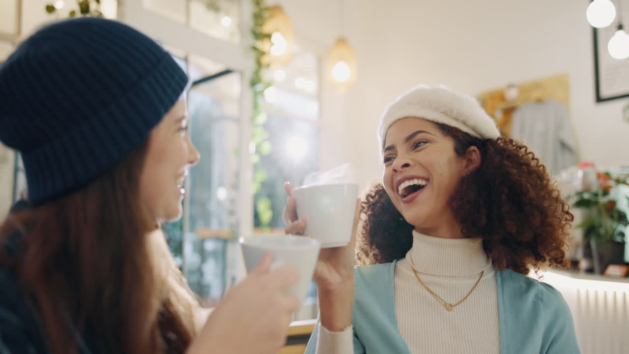 Two friends enjoying coffee and conversation in a cafe