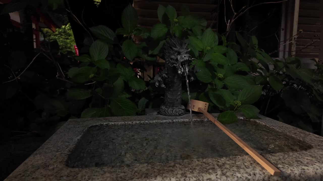 Temizuya ceremonial purification fountain Shinto shrine Buddhist temples in Japan