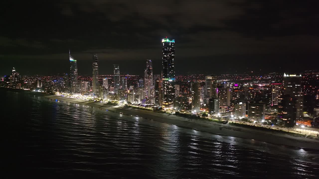 Amazing drone panoramic night cityscape of Gold Coast, Australian metropolitan city on the beach.