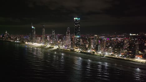 amazing drone panoramic night cityscape of gold coast, australian metropolitan city on the beach.