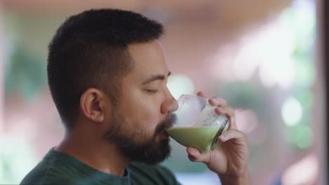 man drinking green tea