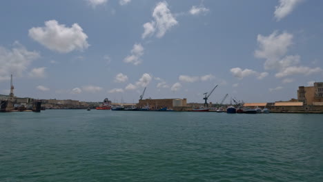 sailing near seaport of the historic city of valletta, malta in europe