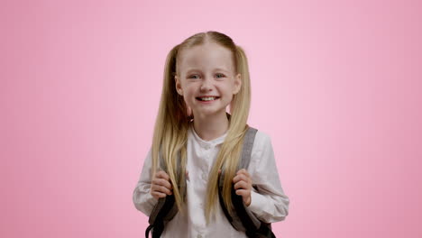 happy schoolgirl with backpack
