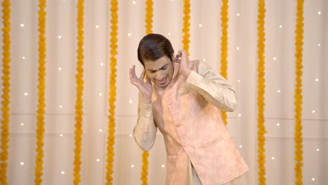 Scared-Indian-man-waiting-for-firecracker-to-burst