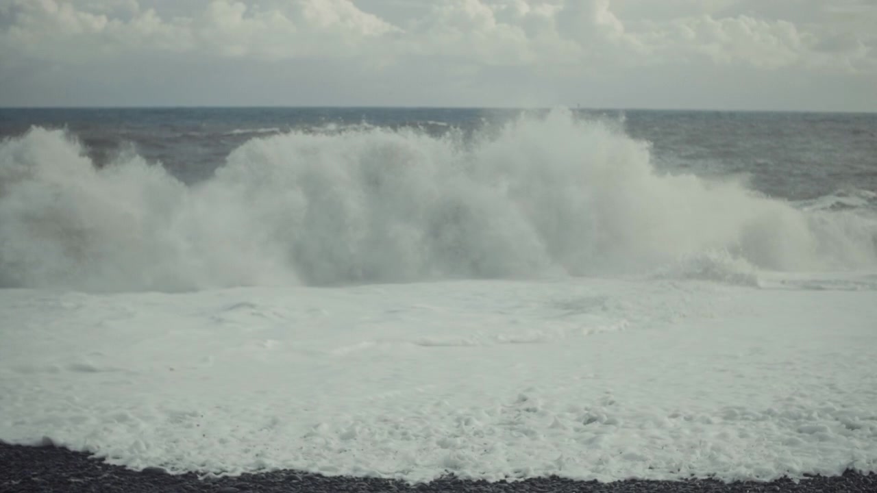 Powerful Ocean Waves Crashing on a Pebble Beach