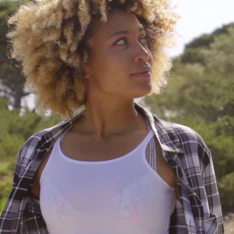 Young-Woman-Looking-Up-to-the-Side-on-Sunny-Day