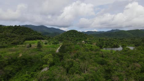 aerial sliding footage towards the left revealing kaeng krachan national park, unesco world heritage site, thailand