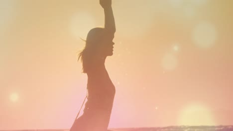 young meditating woman on the beach