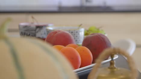 revealing shot of a plate of a freshly picked variety of fruit